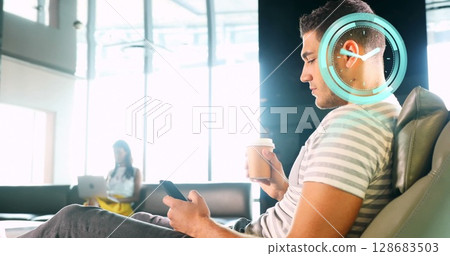 Image of clock moving over biracial businessman using smartphone 128683503