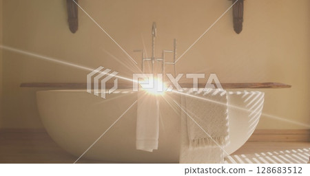 Image of light spots over bath and towels 128683512
