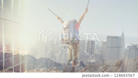 Image of cityscape over disabled caucasian man with arms outstretched hiking 128683567