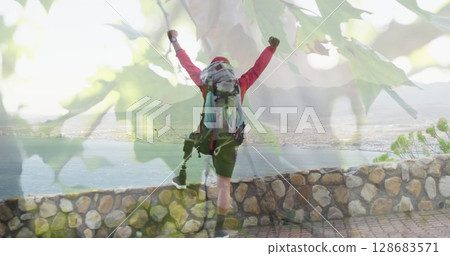 Image of tree over disabled biracial man with arms outstretched 128683571