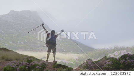 Image of landscape over disabled biracial man with arms outstretched 128683572