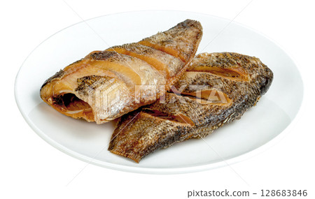 Fried Gourami fish in plate isolated Fried Gourami fish in plate isolated 128683846