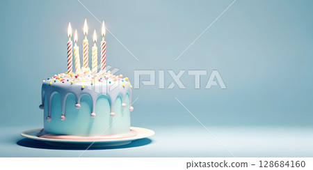 A sweet celebration awaits with this frosted birthday cake adorned with lit candles and vibrant sprinkles against a blue backdrop. 128684160