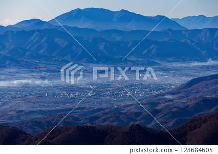 The Kofu Basin and Mt. Kenashi and Mt. Amegatake in the morning mist as seen from Mt. Kentoku and Ogidaira The Kofu Basin and Mt. Kenashi and Mt. Amegatake in the morning mist as seen from Mt. Kentoku and Ogidaira 128684605