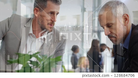 Image of financial data processing over diverse business people in office Image of financial data processing over diverse business people in office 128684706