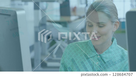 Image of data processing over caucasian businesswoman in office Image of data processing over caucasian businesswoman in office 128684707
