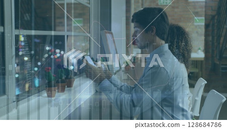 Image of data processing over caucasian businessman using tablet 128684786