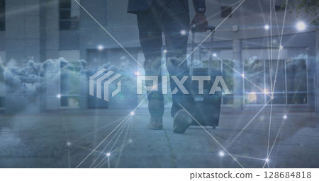 Image of data processing over clouds and biracial businessman walking Image of data processing over clouds and biracial businessman walking 128684818