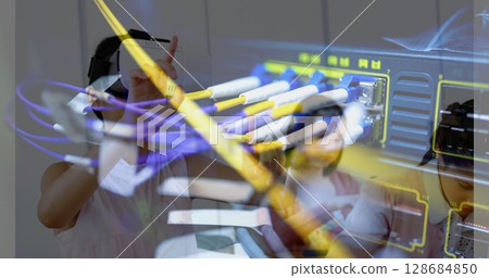 Image of server room over biracial girl using vr headset 128684850