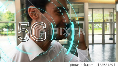 Image of 5g over biracial businessman using smartphone in office 128684891