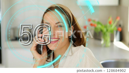 Image of 5g over happy caucasian businesswoman using smartphone in office 128684902