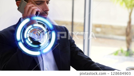 Image of processing circle over caucasian businessman using smartphone in office 128684903