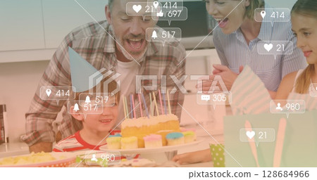 Image of falling icons over happy caucasian family spending time together Image of falling icons over happy caucasian family spending time together 128684966