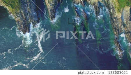 Image of landscape with ocean over caucasian couple running at beach Image of landscape with ocean over caucasian couple running at beach 128685031