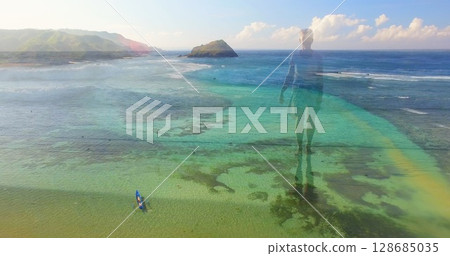 Image of landscape with ocean over caucasian woman walking at beach Image of landscape with ocean over caucasian woman walking at beach 128685035