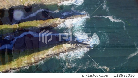 Image of landscape with ocean over family embracing at beach Image of landscape with ocean over family embracing at beach 128685036