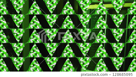 Green abstract triangular shapes over computer server room Green abstract triangular shapes over computer server room 128685095