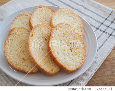 Delicious rusks on a plate Delicious rusks on a plate 128686041