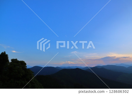 Sunset sky, blue sky, clouds, trees, mountains 128686302