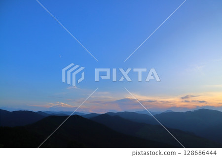 Sunset sky clouds mountains Sunset sky clouds mountains 128686444
