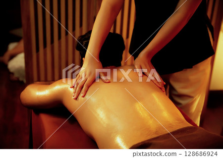 Caucasian man customer enjoying relaxing anti-stress massage. Quiescent 128686924