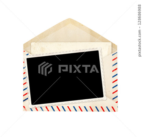 Top view of blank vintage aged opened letter paper envelope with striped edges and photo and card inside. Retro photo frame in old envelope with blank card. Isolated on white background 128686988