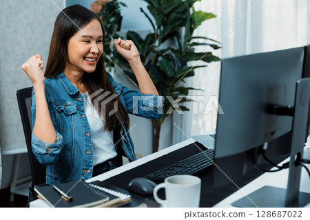 Successful Asian freelancer getting creative project on website. Stratagem. Successful Asian freelancer getting creative project on website. Stratagem. 128687022