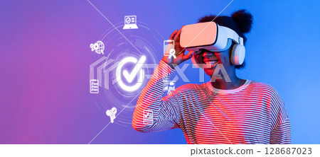 Woman Wearing Virtual Reality Headset with Digital Interface and Quality Control Icons for Technology in Modern Management System XDMCP Woman Wearing Virtual Reality Headset with Digital Interface and Quality Control Icons for Technology in Modern Management System XDMCP 128687023