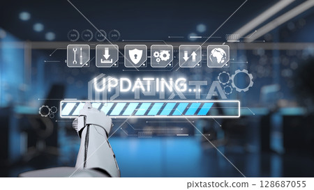Futuristic robotic hand interacting with digital user interface showing updating progress in a modern office environment with blue tones and technology elements. Auvana 128687055