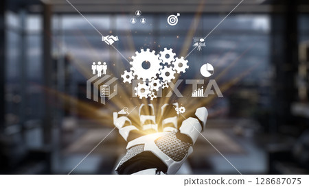 Futuristic Robot Hand Reaching Out with Business Symbols and Icons Representing Technology, Innovation, and Automation in Modern Workspace. Auvana 128687075