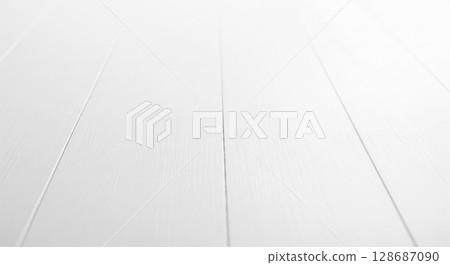 White wooden floor with perspective view receding into blurry background, empty wood stage for product presentation, clean bright table surface for display mockup 128687090