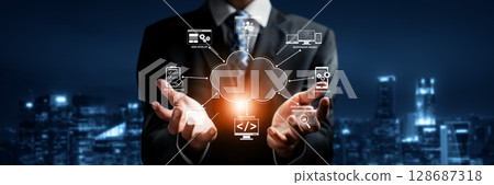 Businessman showcasing cloud computing solutions with programming and coding symbols in a digital cityscape at night for online development services XDMCP Businessman showcasing cloud computing solutions with programming and coding symbols in a digital cityscape at night for online development services XDMCP 128687318