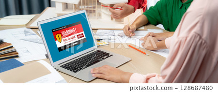 Virus warning alert on computer screen detected brisk cyber threat 128687480
