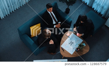 Smart businessman present strategy to investor by using mind map. Directorate. Smart businessman present strategy to investor by using mind map. Directorate. 128687579