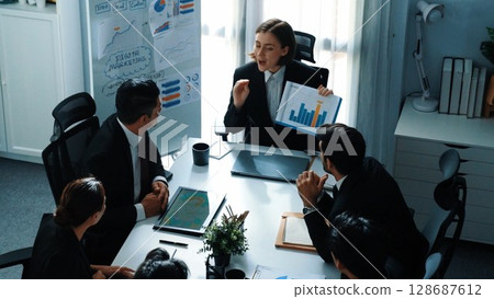 Top view of manager show increase sales chart while team clap hand. Directorate. 128687612