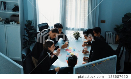 Top view of smart business people brainstorm by using sticky notes. Directorate. 128687630