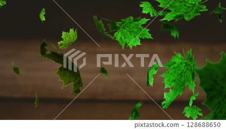 Image of leaves floating over black background Image of leaves floating over black background 128688650