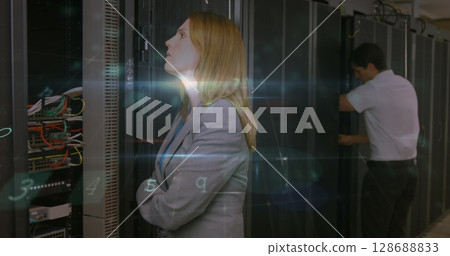 Image of virus warning and caucasian woman and man checking servers 128688833