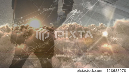 Image of data processing over african american businessman walking Image of data processing over african american businessman walking 128688978