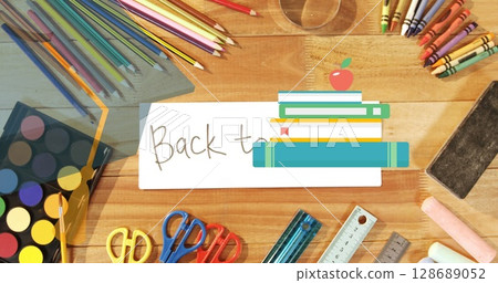 Image of mortarboard, schoolbooks and stationery over back to school text and art equipment 128689052