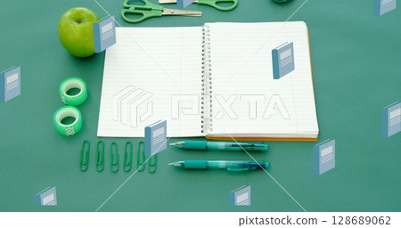 Image of blue schoolbooks moving over notebook and school stationery on desk Image of blue schoolbooks moving over notebook and school stationery on desk 128689062