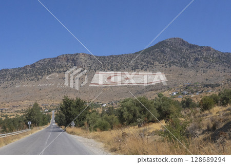 A photo of the flag of the Turkish Republic of Northern Cyprus in the Kyrenia Mountains 128689294