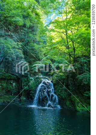 A small waterfall in green A small waterfall in green 128689700