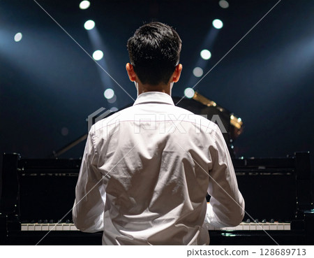 Men playing the piano 128689713