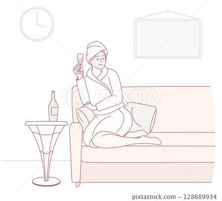 Enjoying Relaxation at Home A Cozy Evening with a Glass of Wine and Great Comfort 128689934