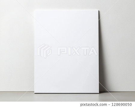 Blank white canvas leaning on wall minimalistic clean art space for creativity 128690050