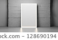 Illuminated blank rectangular frame on textured concrete wall with soft reflection 128690194