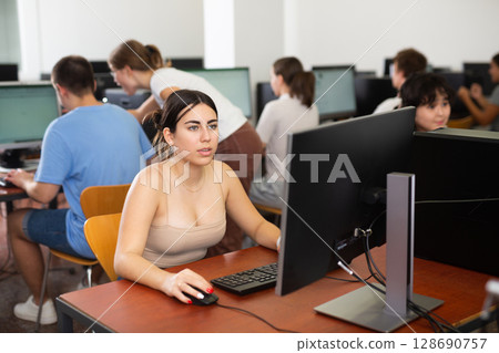 Teenager girl using PC during computer science lesson Teenager girl using PC during computer science lesson 128690757
