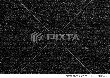 Black porous foam padding with layered structure and soft textured surface. Protective packaging material. Abstract dark background Black porous foam padding with layered structure and soft textured surface. Protective packaging material. Abstract dark background 128690822