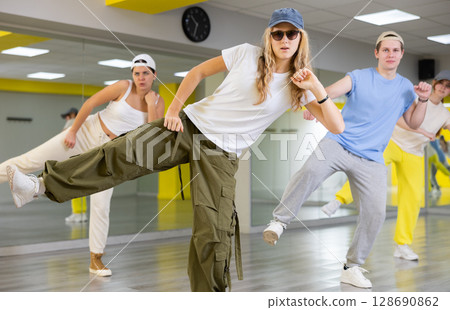 Teenage girl training breakdance Footwork moves in dance hall 128690862